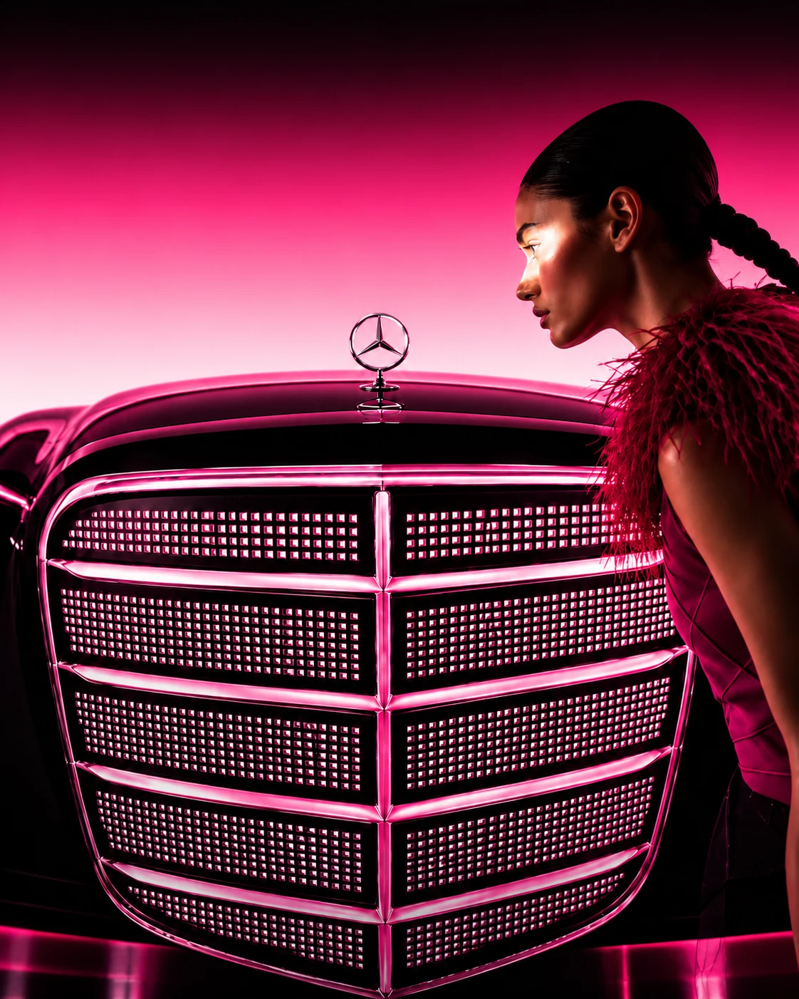 Portrait beside an illuminated pink automotive grille